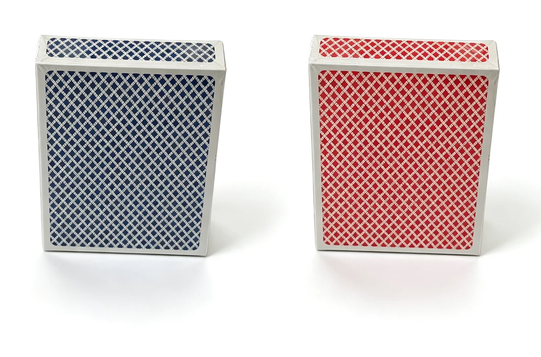 Red and blue patterned playing card tuck boxes shown side by side